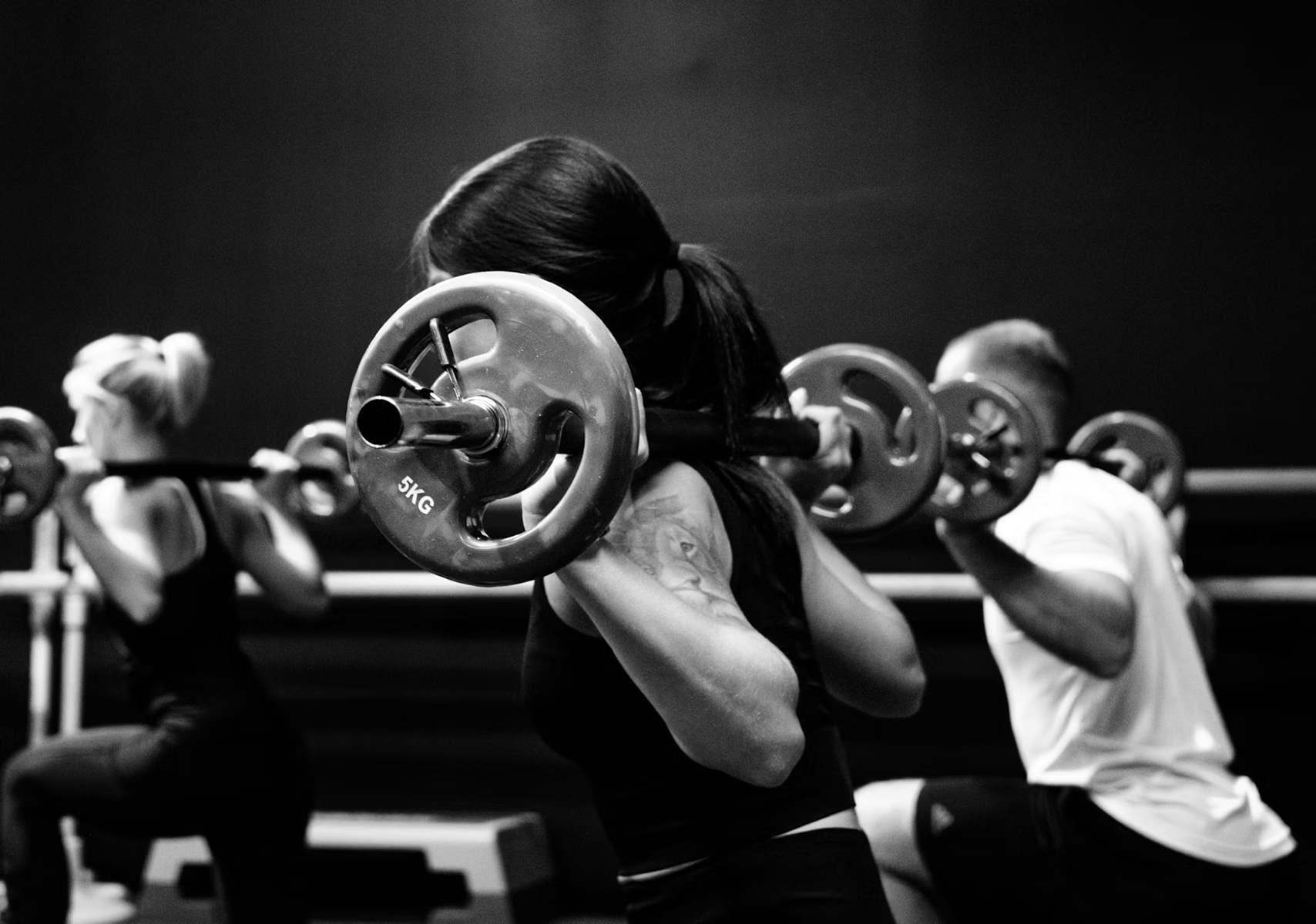 Image of person squatting with a barbell